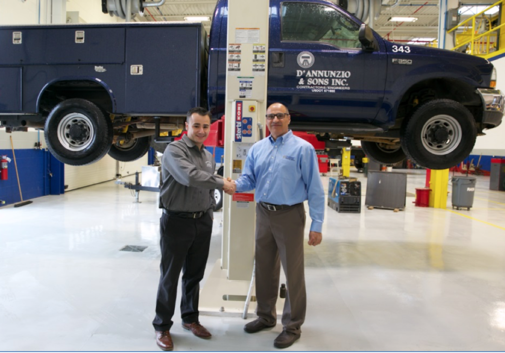 Pictured left to right: Matthew Morgan, principal at Stertil-Koni distributor, Hoffman Services and John Cafro, Equipment Manager at D’Annunzio & Sons, in front the of two-post Freedom Lift