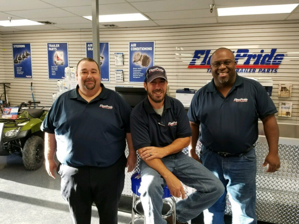 Team members of the new FleetPride New Orleans branch in their showroom. Branch Manager Alan Honeysucker is at right.